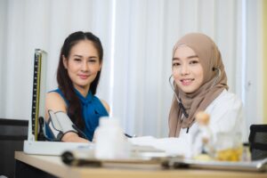 muslim doctors explain the health examination results to patient that receives annual health checks.jpg