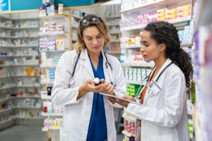two pharmacists working together at pharmacy.jpg